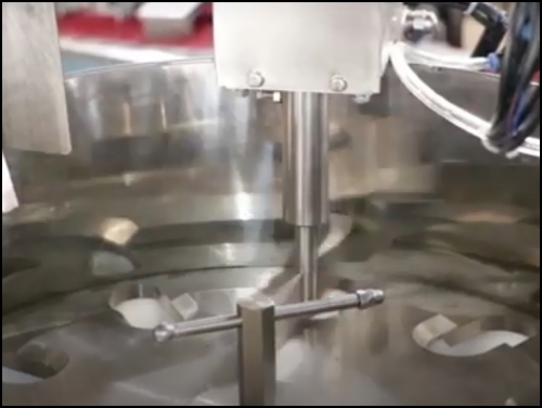 Circular cup filler system of premade pouch fill and seal machine